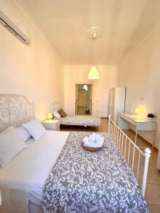 Posteľ alebo postele v izbe v ubytovaní Galasso Apartments