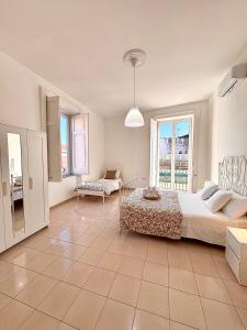 Posteľ alebo postele v izbe v ubytovaní Galasso Apartments