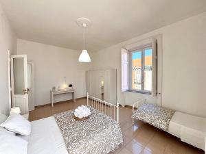 Posteľ alebo postele v izbe v ubytovaní Galasso Apartments