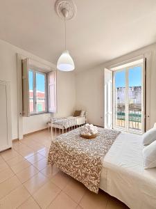 Posteľ alebo postele v izbe v ubytovaní Galasso Apartments