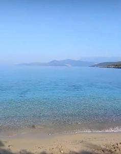 a large body of water with a beach at Villa Symphony apartments Kotor Tivat in Kotor