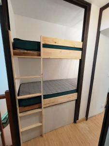 a bunk bed in a small room at Appart 4/6 pers pied des pistes La Mongie in Bagnères-de-Bigorre