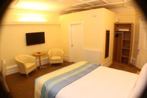 A bed or beds in a room at iSleep at The Drake 