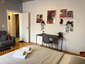 En eller flere senge i et værelse på Casa Terracota in City Square