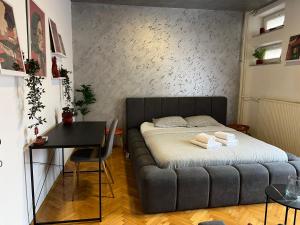 En eller flere senge i et værelse på Casa Terracota in City Square + 1 billede