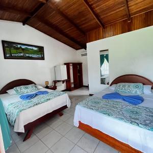 Ένα ή περισσότερα κρεβάτια σε δωμάτιο στο Hotel Villa Fortuna