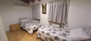 En eller flere senge i et værelse på Mansarda nelle Dolomiti + 3 billeder