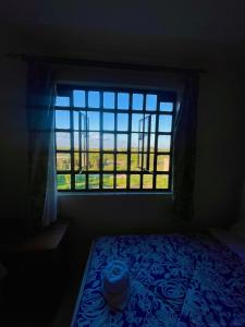 Postel nebo postele na pokoji v ubytování Blissful Stays Thika