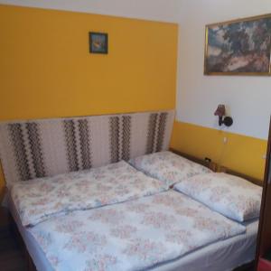 a bed in a small room with at Horváth Apartman Badacsonytomaj in Badacsonytomaj