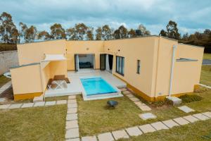 a house with a swimming pool in the backyard at Phelgone Nanyuki in Nanyuki