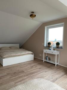 Postel nebo postele na pokoji v ubytování Ferienwohnung Kilz II in Gensingen