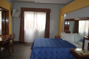 Voodi või voodid majutusasutuse Hotel Mina toas
