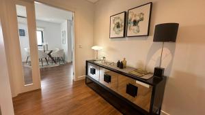 a living room with a table and a dining room at River View apartment in Chaves