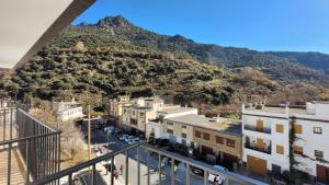 a view of a city with a mountain at Alojamiento rural Casa Clara la Pescaora in Trevélez