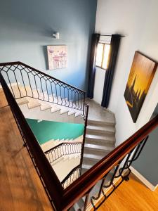 a staircase in a house with a painting on the wall at Modern Studio N9 Kitchenette Bathroom in Limassol