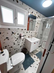 a bathroom with a toilet and a sink at Modern Studio N9 Kitchenette Bathroom in Limassol