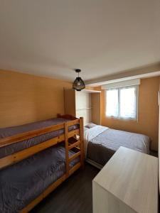 Posteľ alebo postele v izbe v ubytovaní Le Pouliguen/La Baule Appartement T3