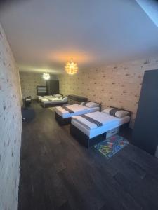 Postel nebo postele na pokoji v ubytování Apartmán pod věží