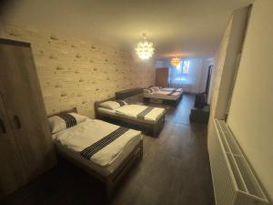 Postel nebo postele na pokoji v ubytování Apartmán pod věží