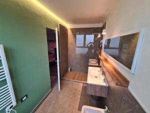 a bathroom with a sink and a mirror at Be Magenta, Art Home - Rose style - Near Milano, Rho Fiera, Malpensa in Magenta +92 photos