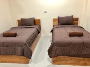 Postel nebo postele na pokoji v ubytování บ้านศรีสุธรรม 2 Baansrisuthum 2 + 103 fotografií