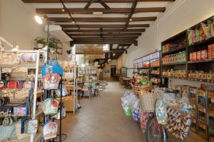 a grocery store with a bike in the aisle at Armenian House by IIP in George Town