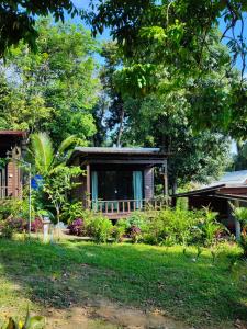a house with a garden in front of it at Velora Bay Koh Jum in Ko Jum
