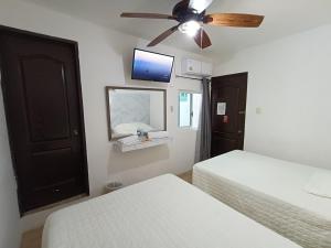 Postel nebo postele na pokoji v ubytování Hotel Rath
