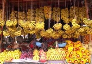 a fruit stand with bunches of bananas and other fruits at Banana Beach Flat in Agadir