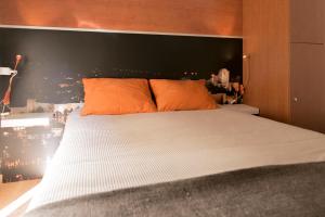 
a bedroom with a bed and a lamp at Chinitas Urban Hostel in Málaga
