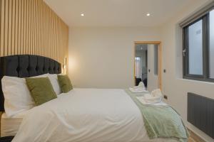 En eller flere senge i et værelse på Cosy Modern Flat Sleeps 3 Direct Links to Central London - Flat 2