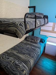 Кровать или кровати в номере Alójate en Vigo! Casita bien equipada