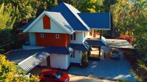 an overhead view of a house with blue roof at Nadackal Nature County in Munnar +53 photos