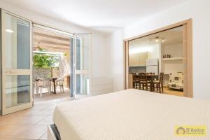 En eller flere senge i et værelse på Villa Gaia