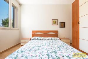 En eller flere senge i et værelse på Villa Gaia