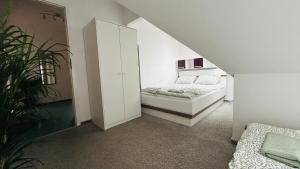 Łóżko lub łóżka w pokoju w obiekcie Apartament Słoneczny 1