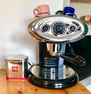 a coffee pot on top of a coffee maker at La Causeuse in Thonon-les-Bains +13 photos