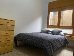 Postel nebo postele na pokoji v ubytování Cal Nas Ratat
