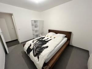Postel nebo postele na pokoji v ubytování Appartements Charles De Gaulle