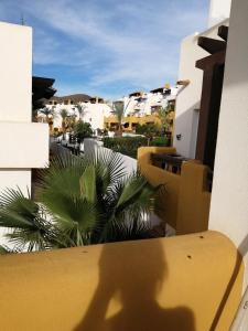 a shadow of a person standing on a balcony at Lomas del mar V in Vera