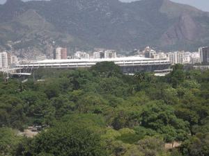 a large white building in the middle of a city at Apartament 11th floor in Rio de Janeiro