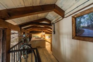 a bicycle is parked in a tiny house hallway at Guest House Vrelo in Virpazar