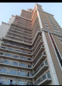 a tall apartment building with a tall at ميدوكليه بشاك شهير in Basaksehir