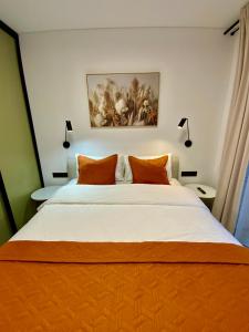 Postel nebo postele na pokoji v ubytování Alėjos Apartmentai City