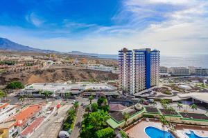 an aerial view of a city and the ocean at 14th floor Sea View in Adeje