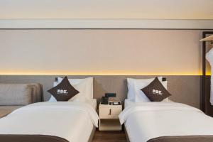 DDK Collection Hotel客房内的一张或多张床位