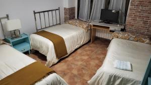 Cama o camas de una habitación en Casa Santa Maria I con barbacoa