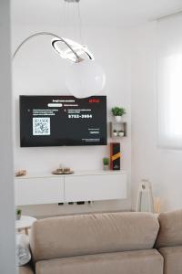 TV a/nebo společenská místnost v ubytování NSH Apart Malpensa + 11 fotografií