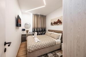 a small bedroom with a bed and a window at NN HOME viale xx settembre in Trieste