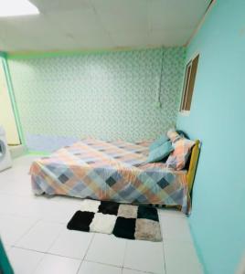 a bedroom with a bed and a rug on the floor at Bedroom apartment in Al Mafraq